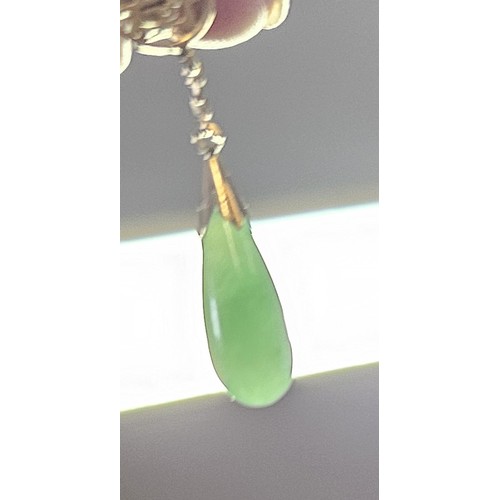 594 - A pair of 9ct gold jade drop earrings with Chinese symbols to the top, 30mm total drop, 3.6g