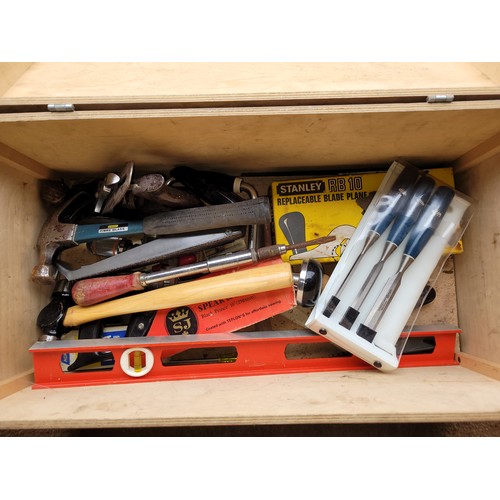 31 - A wooden toolbox containing  a collection of carpenters tools.