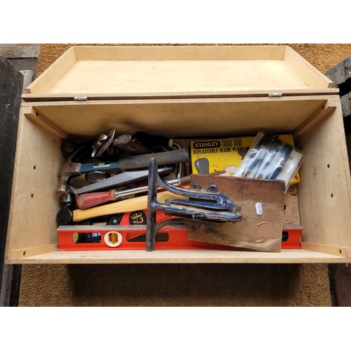 31 - A wooden toolbox containing  a collection of carpenters tools.