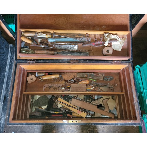 35 - A large toolbox containing a collection of carpenters hand tools.