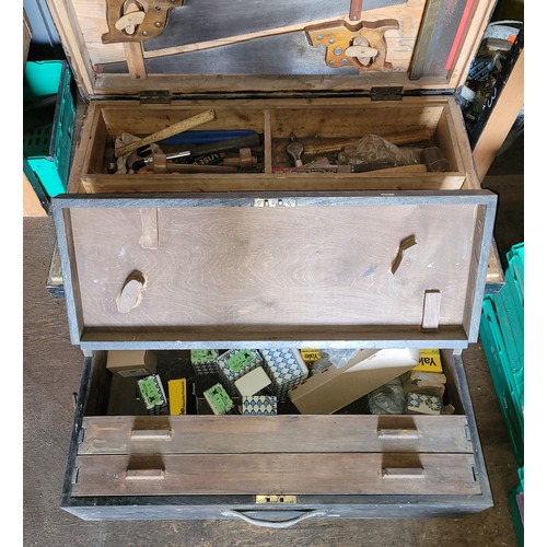 36 - A large toolbox containing a collection of carpenters hand tools.