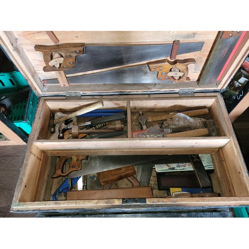 36 - A large toolbox containing a collection of carpenters hand tools.