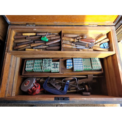 54 - A large toolbox containing a collection of carpenters hand tools.