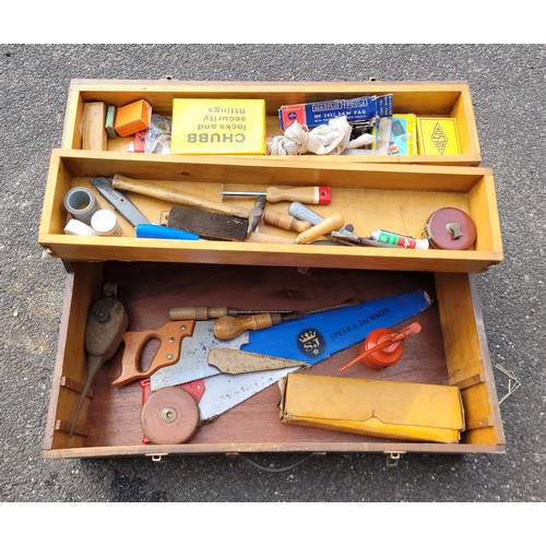 55 - A toolbox containing a collection of carpenters hand tools.