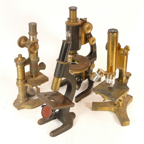 112 - Four early 20th century brass microscopes, some appear unused, makers to include R.J Beck of London,... 