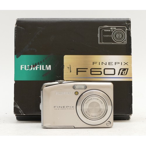 A Fujifilm Finepix F60 digital camera, serial number 8DQ09679