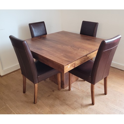 A modern square dining table raised on a pedestal support and matching high back brown leather dining chairs, 120x120cm.