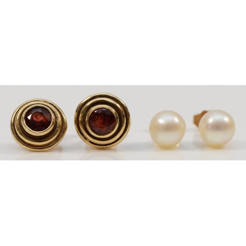 1198 - A 9ct gold pair of garnet ear studs, 3.1gm and a pair of 7mm bead cultured pearl ear studs.