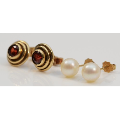 1198 - A 9ct gold pair of garnet ear studs, 3.1gm and a pair of 7mm bead cultured pearl ear studs.