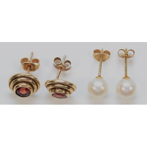 1198 - A 9ct gold pair of garnet ear studs, 3.1gm and a pair of 7mm bead cultured pearl ear studs.