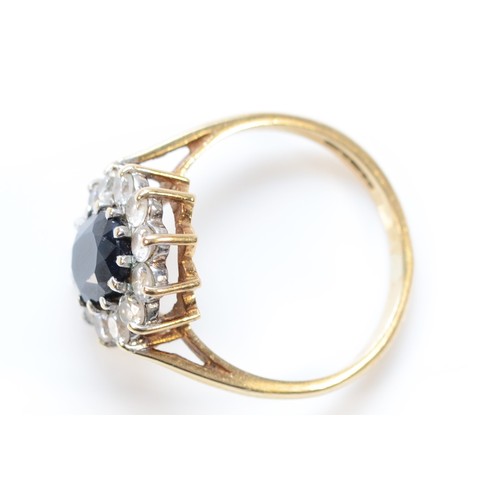 1317 - A 9ct gold sapphire and white stone cluster ring, M, 3.1gm