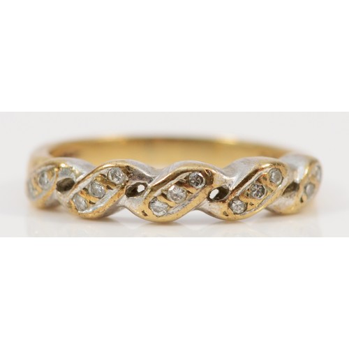 1216 - A 9ct gold brilliant cut diamond twist ring, L, 2.6gm