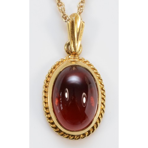 1220 - A 9ct gold and cabochon garnet pendant, stone, 13 x 10mm, 38cm chain, 4.5gm