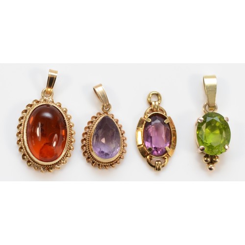 1274 - A 9ct gold amber mounted pendant, 13 x 8mm, two amethyst pendants and a green stone pendant, 5.2gm