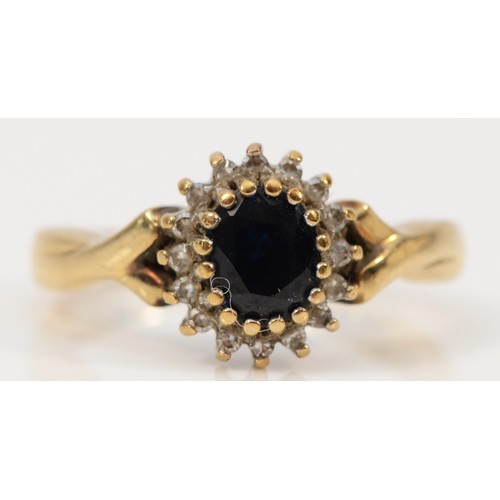 1490 - A 9ct gold vintage sapphire and diamond halo dress ring, J, 2.8g