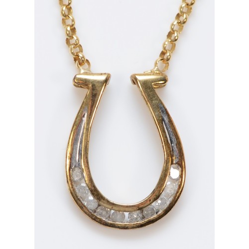 1494 - A 9ct gold pendant necklace in the shape of a horse shoe, 3.3g