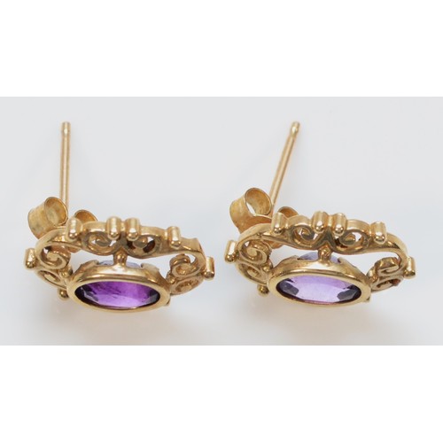 1503 - A pair of 9ct gold amethyst stud earrings, 12mm length, 1.3g