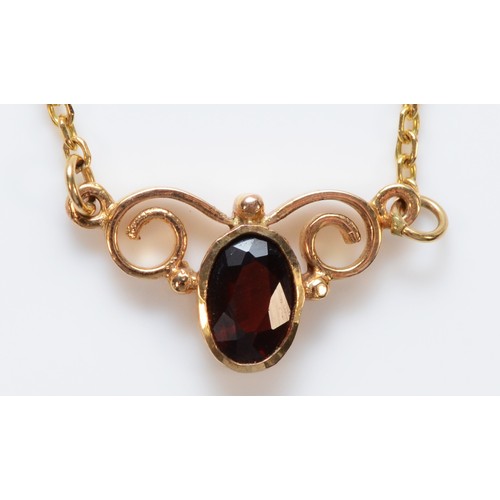 1523 - A 9ct gold vintage garnet necklace, 13mm front, 2.2g