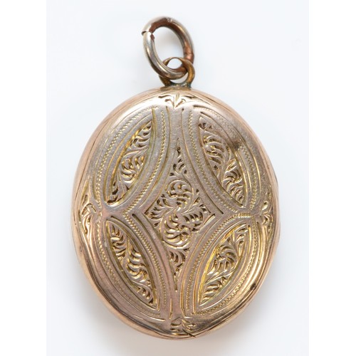 1286 - A 9ct gold back and front antique patterned locket, 23mm length, 4.8g