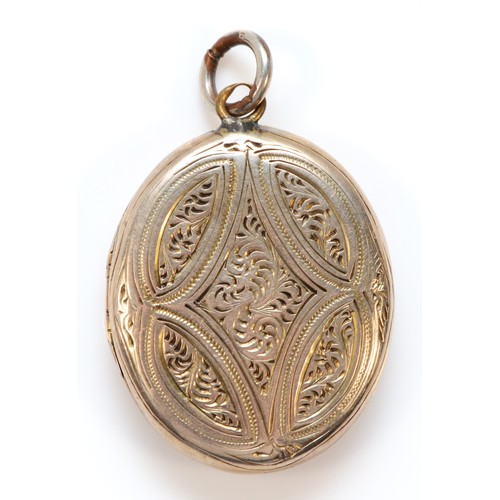 1286 - A 9ct gold back and front antique patterned locket, 23mm length, 4.8g