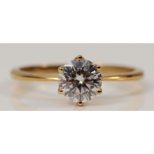 1299 - A 9ct gold synthetic moissanite solitaire ring, P, 1.6g