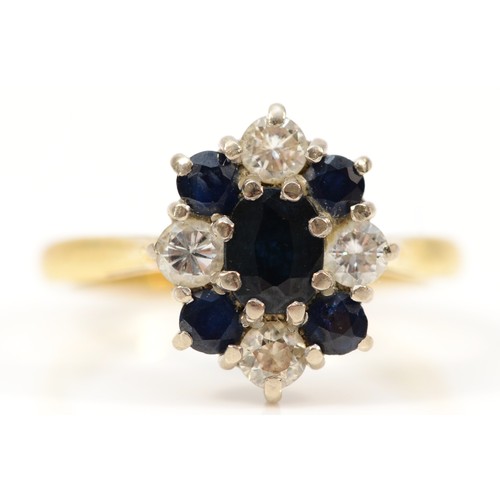 1374 - An 18ct gold sapphire and brilliant cut diamond cluster ring, London 1970, M, 4.2gm