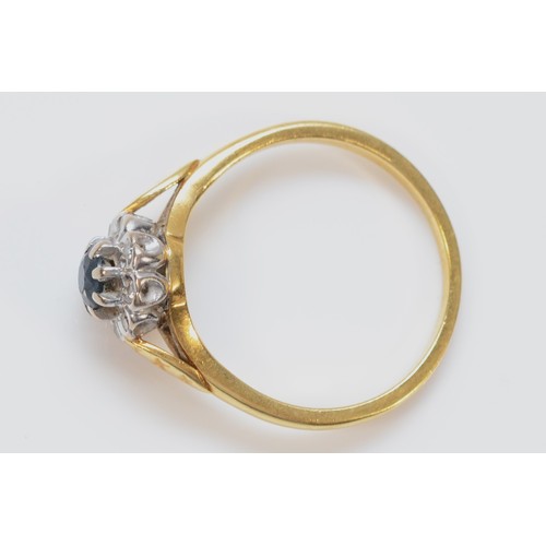 1416 - An 18ct gold sapphire and diamond cluster ring, P, 4gm