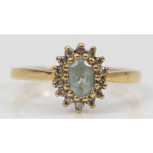 1418 - A 9ct gold aquamarine and brilliant cut diamond cluster ring, N, 2.6gm