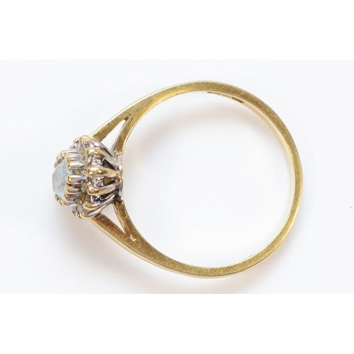 1418 - A 9ct gold aquamarine and brilliant cut diamond cluster ring, N, 2.6gm