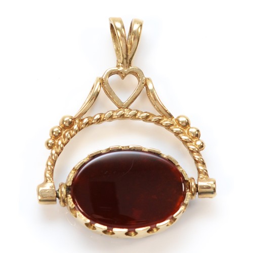 1419 - A 9ct gold swivel fob pendant, set with carnelian and onyx, 28mm wide, 6.9gm