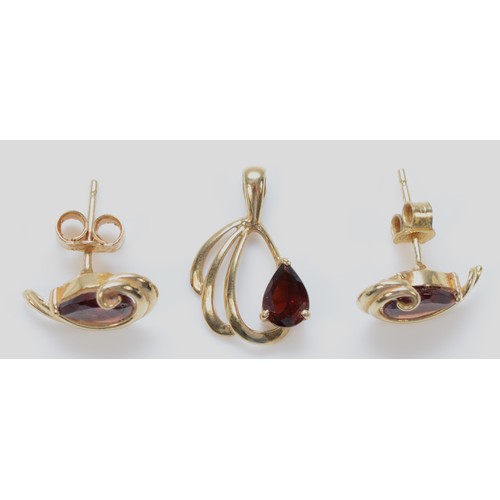 1380 - A pair of 9ct gold pear cut garnet earrings with scroll backs, together with a matching pendant, 15m... 