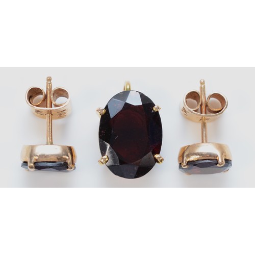 1381 - A pair of 9ct gold garnet earrings together with a matching pendant, 14mm x 10mm pendant, 5.1g