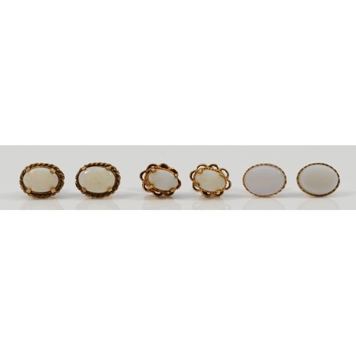 1383 - Three pairs of 9ct gold opal stud earrings with scroll backs, 2.9g