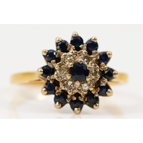 1393 - An 18ct gold sapphire and diamond cluster ring, J 1/2, 3.8g