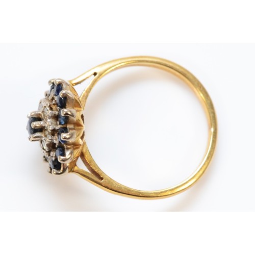 1393 - An 18ct gold sapphire and diamond cluster ring, J 1/2, 3.8g