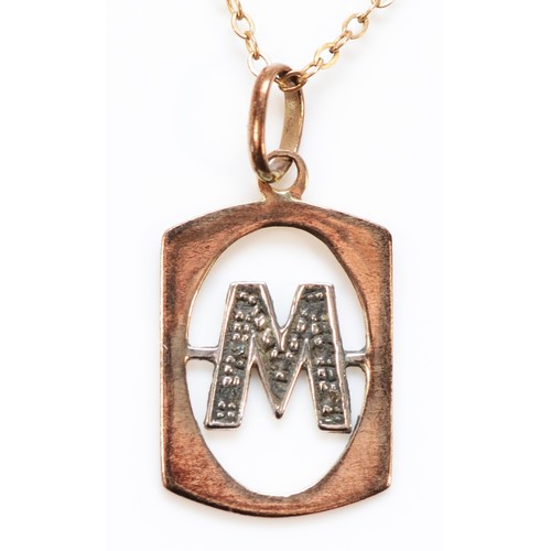 1421 - A 9ct gold diamond initial M pendant with 9ct gold chain, 16mm x 12mm pendant, 1.8g