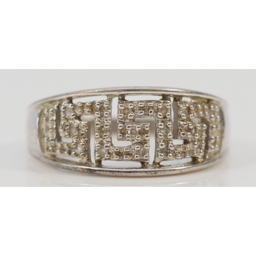 1241 - A 9ct white gold diamond Greek key patterned ring, P, 3.9g