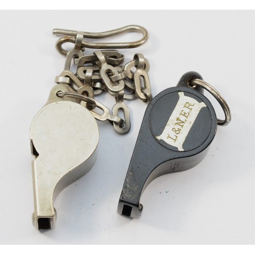 35 - L.M.S., a nickel The Acme Thunderer whistle, stamped, with chain and a black plastic The Acme Thunde... 