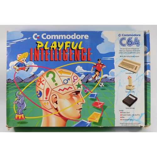 A boxed Commodore C64 Playful Intelligence pack with power supply unit.
