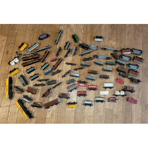 24 - Hornby 00 Gauge Railways; A large collection of over sixty five Dublo unboxed model railway rolling ... 