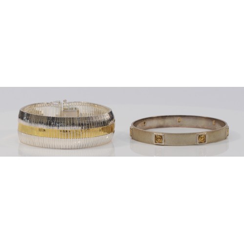 46 - A Scottish silver and gold bangle, by SC, Edinburgh 2003, 63mm and an Italian silver bracelet, 19.3c... 