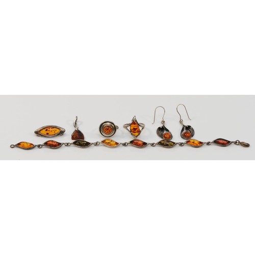 61 - A 925 silver and amber bracelet, 22cm, two rings, a brooch and a pair of ear rings, 28gm