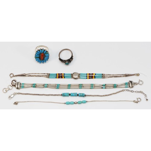 63 - Four silver and turquoise Native American bracelets and two rings, 28gm