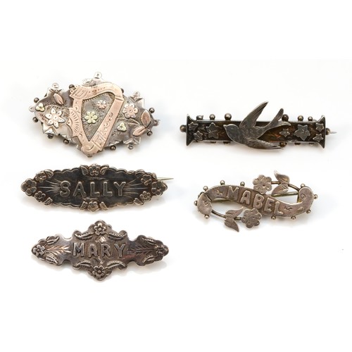 69 - A Victorian silver and applied gold harp brooch, Birmingham 1890, three name brooches and a swallow ... 