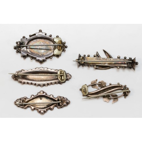 69 - A Victorian silver and applied gold harp brooch, Birmingham 1890, three name brooches and a swallow ... 