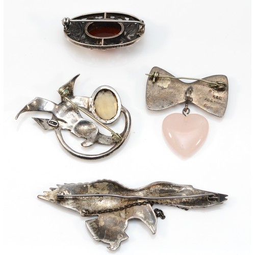 71 - A silver and marcasite eagle brooch, Birmingham 1947, 80mm and three other brooches, 49gm