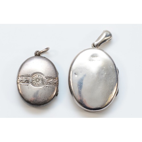 79 - A Victorian silver locket, Birmingham 1881, 40 x 32mm and an unmarked smaller example, 19gm