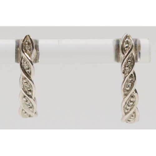 116 - A pair of 9ct white gold diamond drop earrings with scroll backs, 20mm drop, 1.4g