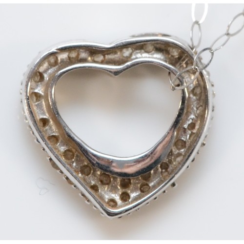 124 - A 9ct white gold diamond heart shaped pendant with chain, 15mm across, 1.9g