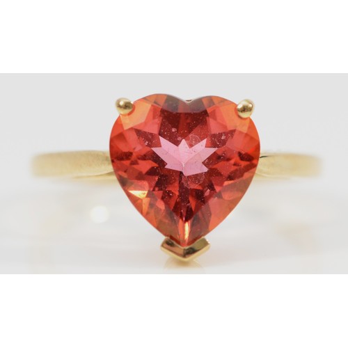 136 - A 9ct gold heart cut red gemstone dress ring, N 1/2, 2.8g